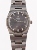 A Tissot automatic stainless-steel wristwatch the round grey dial having raised baton numerals,