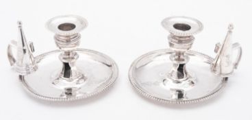 A pair of George III silver chamber sticks by Robert Garrard I, London 1813,