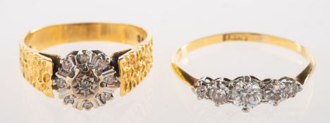 A diamond cluster ring and a diamond five stone ring,