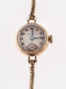 Rolex a lady's 9K gold wristwatch the silvered dial having black Arabic numerals,