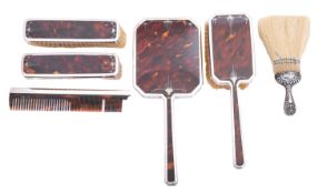 A George V silver and tortoiseshell Art Deco dressing table set by Mappin & Webb, London 1933,