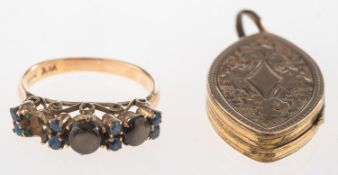 A ring and a locket, the ring set with two brown stone cabochon's showing chatoyancy, (one missing),