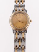 Omega a lady's wristwatch with boxes and paperwork the round dial having raised baton numerals,