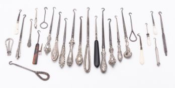 A mixed lot of silver and steel button hooks including; thirteen silver handles,