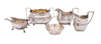 A mixed group of silver including; a George III two handled sugar bowl London 1806-patched,