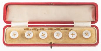 A set of six early 20th century 9ct gold and mother of pearl buttons, with gilt hooks,
