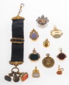 A mixed group of fobs and medallions,