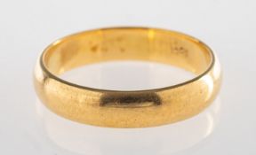 A plain wedding band, indistinct '18ct' mark, size N1/2 to O, 4.1grams.