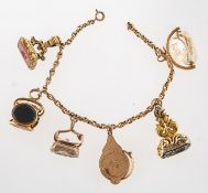 A bracelet with fob seals and a miniature magnifying glass,