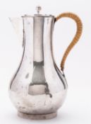 A George III silver hot water jug by Daniel Smith & Robert Sharp, London 1788, of baluster form,