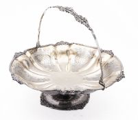 A Russian silver swing handled cake basket by Andrei Kovalsky, Moscow 1846, of lobbed circular form,