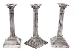 A trio of Corinthian column silver plated candlesticks by Walker and Hall, Sheffield 20th century,