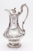 A large Victorian silver hot water jug by Henry Holland, London 1854, of canted baluster form,