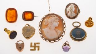 A mixed group of jewellery, including a cameo brooch with a scalloped openwork mount,