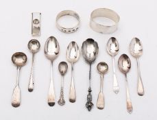 A mixed group of silver including; two modern napkin rings, a cigar cutter, five tea spoons,