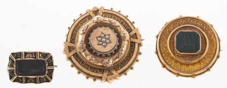 A group of antique mourning jewellery, including a Victorian black enamelled mourning brooch,