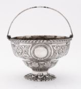 A Victorian silver swing handled sugar bowl by Martin, Hall & Co, London 1871,