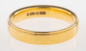 An 18ct yellow gold wedding band, 4mm, UK hallmark, size N1/2, 5.2grams.