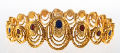 An enamelled oval link bracelet, of graduated articulated openwork textured oval links,