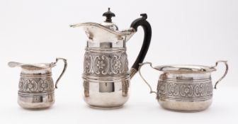 An Edward VII silver sugar bowl and cream jug by W G Keight, Birmingham 1906,