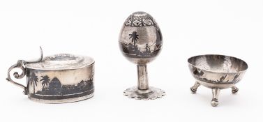 A 20th century Iraqi silver three piece cruet set, not marked comprising a mustard, salt and pepper,