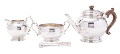 A George VI silver three piece tea service by William Comyns & Sons Ltd, London 1937,