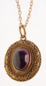 An antique garnet keepsake pendant with chain,