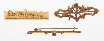 A group of three brooches, including an openwork anchor and foliate brooch,