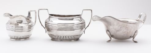 A mixed group of silver including; a Birmingham silver sauce boat by Adie Bros, Birmingham,
