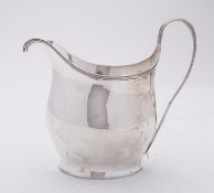 A George IV silver cream jug by Thomas Johnson, London 1803, of oval baluster form, with reeded rim,