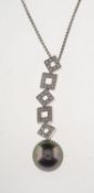 A Tahitian pearl and diamond pendant with chain,