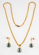 A Tahitian pearl and diamond pendant with chain and a pair of Tahitian pearl earrings,