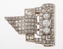 An Art Deco diamond dress clip, of geometric scroll design,