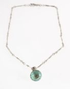 An aquamarine and diamond pendant with chain,