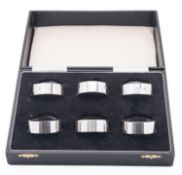 A cased set of Elizabeth II silver napkin rings by Argyll Silver, Birmingham 1987, of plain form,