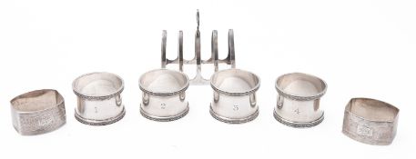 A mixed group of silver including; a set of four napkin rings by Brook & Son, Sheffield 1929,