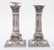 A pair of Victorian silver Corinthian column candlesticks maker's marks rubbed probably by Martin,