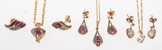 A group of three pendant and earring sets,