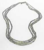 A three row green sapphire necklace,