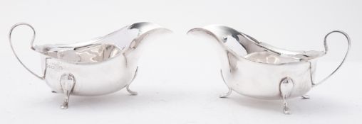 A cased pair of George V silver sauce boats by Barker Brothers Silver Ltd, Birmingham 1935,