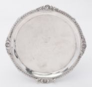 A George III silver salver by Robert Makepeace & Richard Carter, London 1778, of circular form,