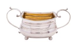 A George III silver two handled sugar basin mark rubbed possible JC, London 1814, of barge shape,