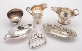 A mixed group of silver including; a helmet shaped cream jug by Mappin Brothers, Sheffield 1895,