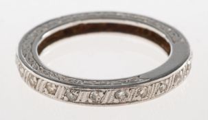 A diamond full eternity ring, a carved band set all the way around with small single-cut diamonds,