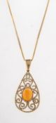 A 9ct gold orange Ethiopian opal pendant with chain,