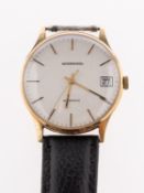 Garrard a 9ct gold gentleman's wristwatch the silvered dial having baton numerals and hands,