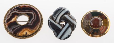 A group of three Scottish agate brooches, including a banded agate brooch in the form of a knot,