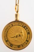 An Australian coin in pendant mount with a gilt chain,