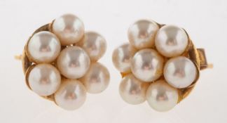 A pair of 9ct gold pearl earrings, of flowerhead design, each set with seven cultured pearls,