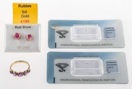 Two loose diamonds, a pair of earrings and a ring,